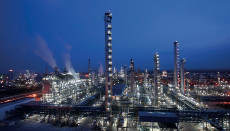 Wide aerial shot of power plant at night